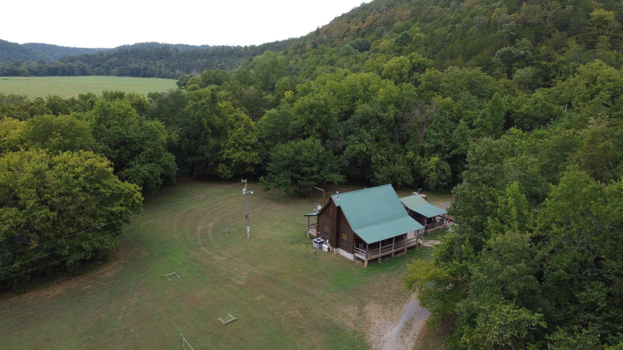 Drone view of Kindling Trail Cabin and surrounding clearing