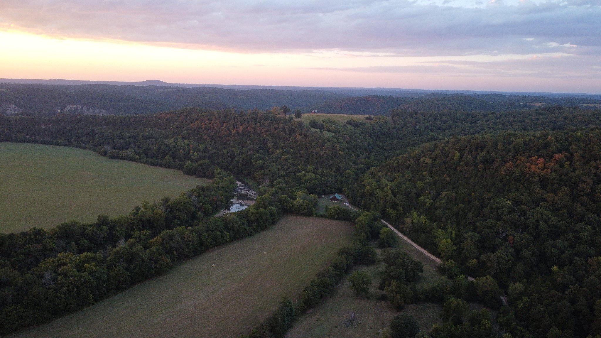Aerial sunset view over the Ozark valley near Kindling Trail Cabin